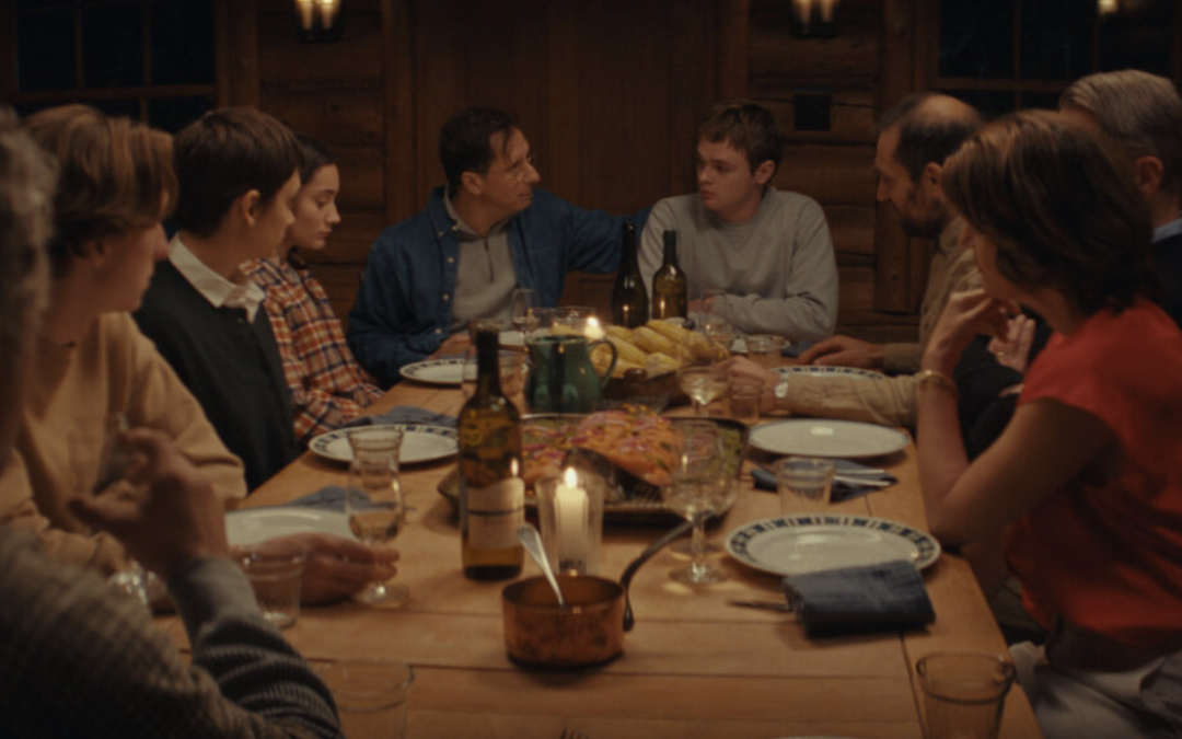 Group having dinner around a rustic table
